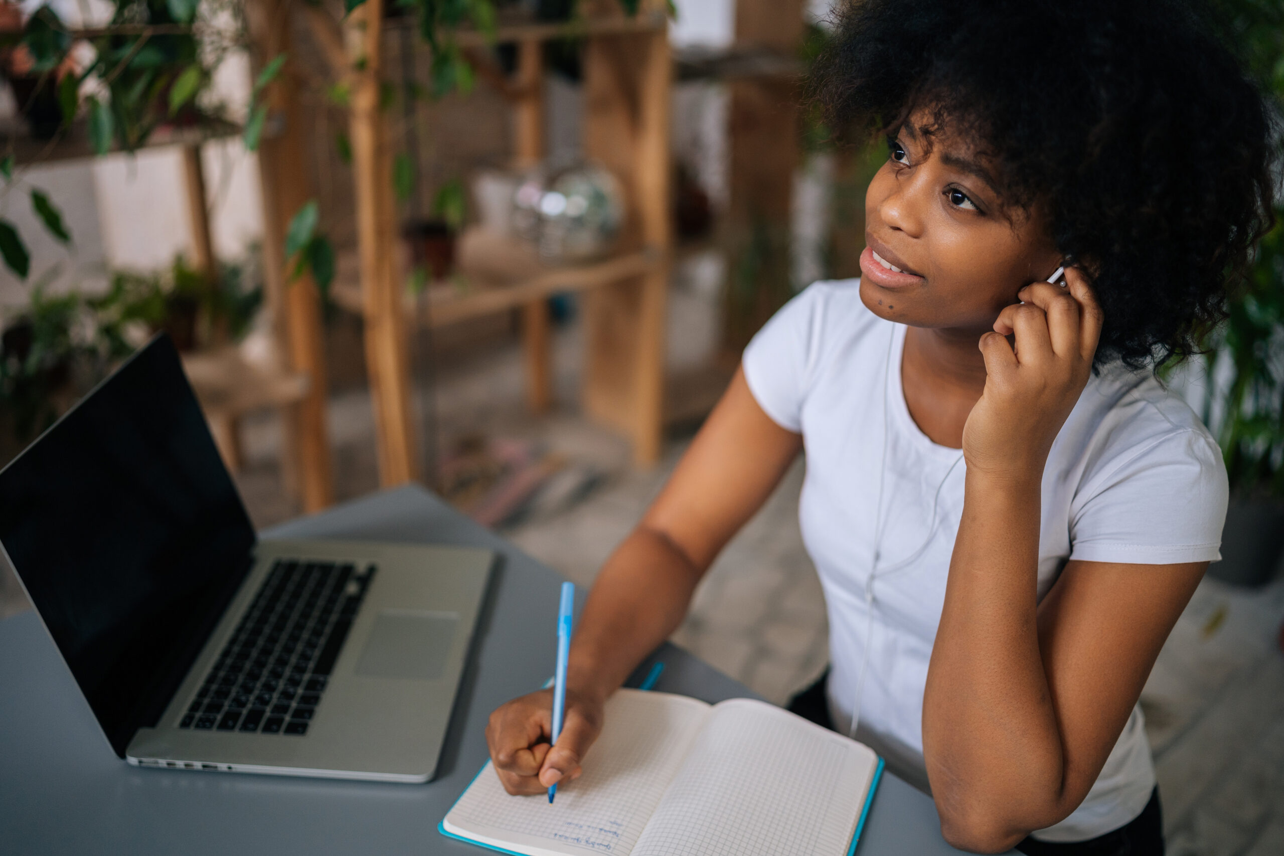 Woman experiencing a breakthrough moment while writing her book, realizing the importance of having a clear action plan and message clarity. 